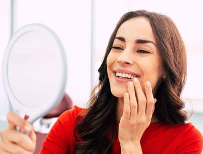 Womain in the last dental implant healing stages {{brizy_dc_image_alt entityId=